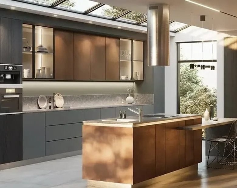 Renovated kitchen with a warm wood island, dark cabinets, and skylights